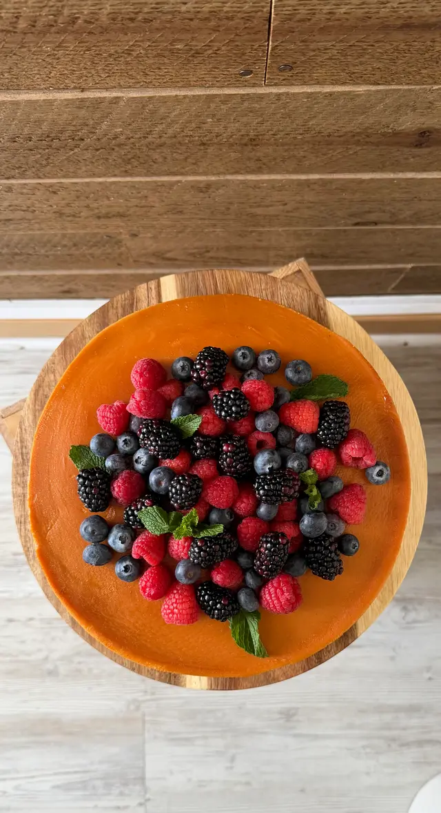 Orange cake dessert with fresh berries